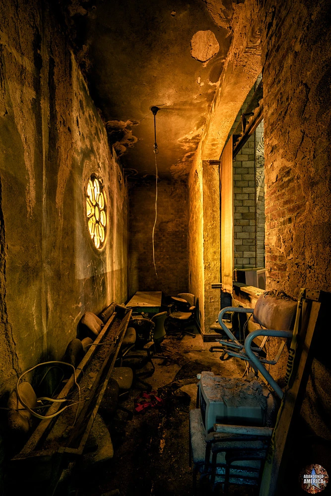 A small chapel, light through a single rosette window.